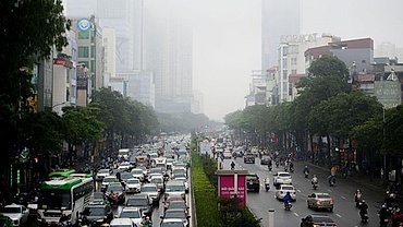 High-rise buildings hidden amid dense fog in Hanoi